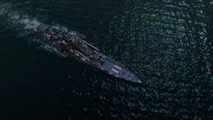 A battleship leaving a trailing wake